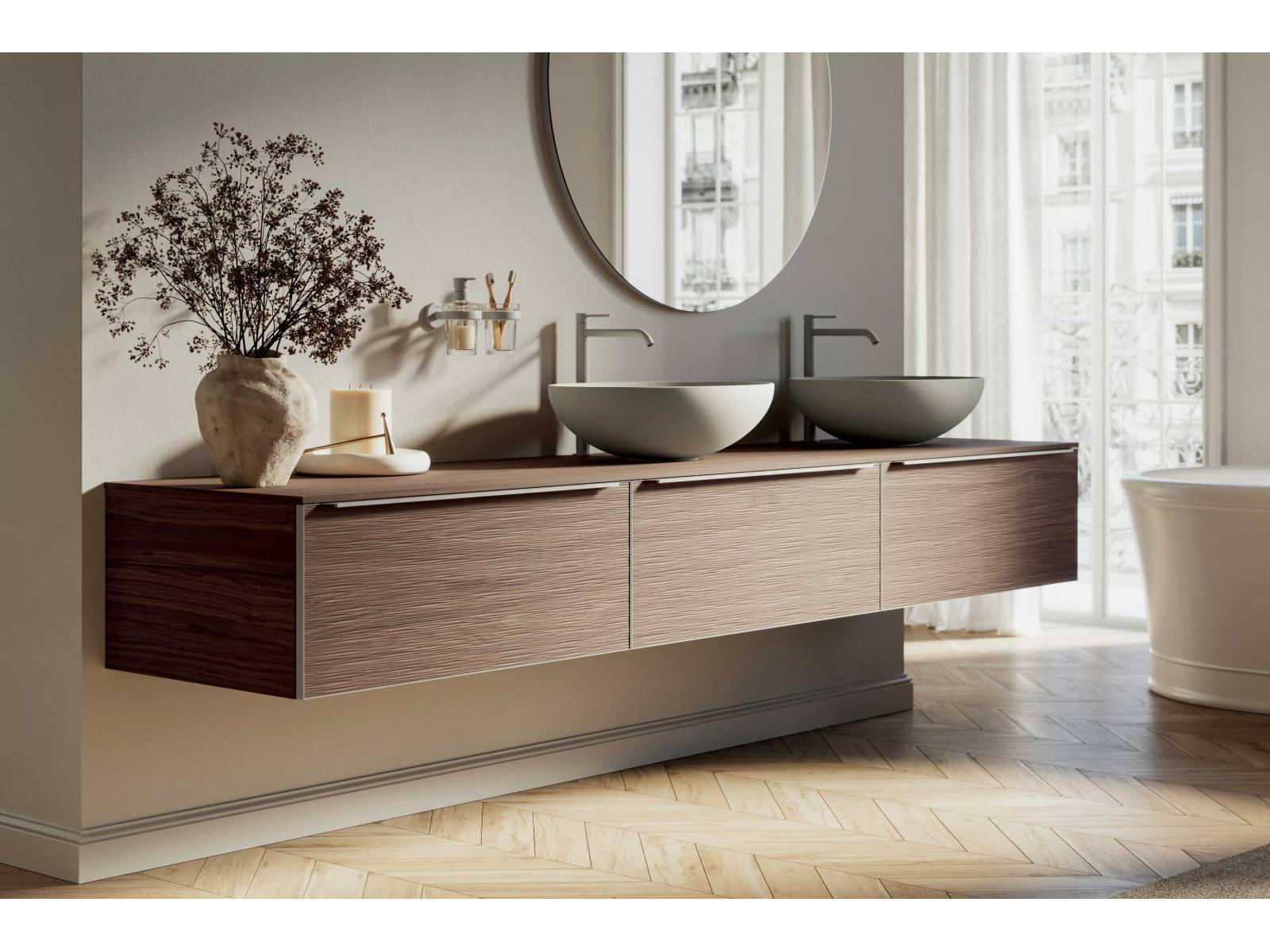 Die neue Badmöbelkollektion «Testadura» zeichnet sich durch 3D-Holzoberflächen aus, die mit einer innovativen Presstechnik hergestellt werden. Die Holzoberflächen sind nur 3 mm dick und weisen sowohl regelmässige geometrische Formen als auch unregelmässige Texturen und Falteffekte auf. In verschiedenen Ausführungen und Farben erhältlich. INDA.