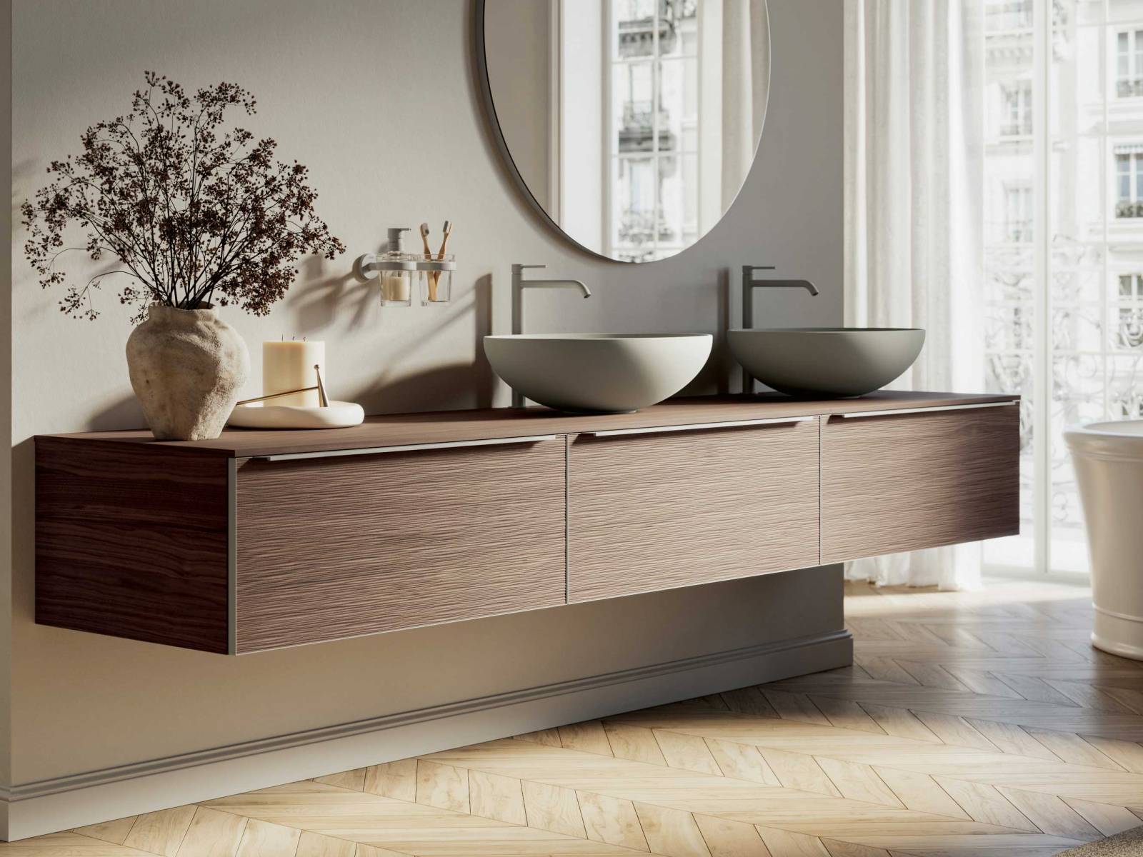 Die neue Badmöbelkollektion «Testadura» zeichnet sich durch 3D-Holzoberflächen aus, die mit einer innovativen Presstechnik hergestellt werden. Die Holzoberflächen sind nur 3 mm dick und weisen sowohl regelmässige geometrische Formen als auch unregelmässige Texturen und Falteffekte auf. In verschiedenen Ausführungen und Farben erhältlich. INDA.