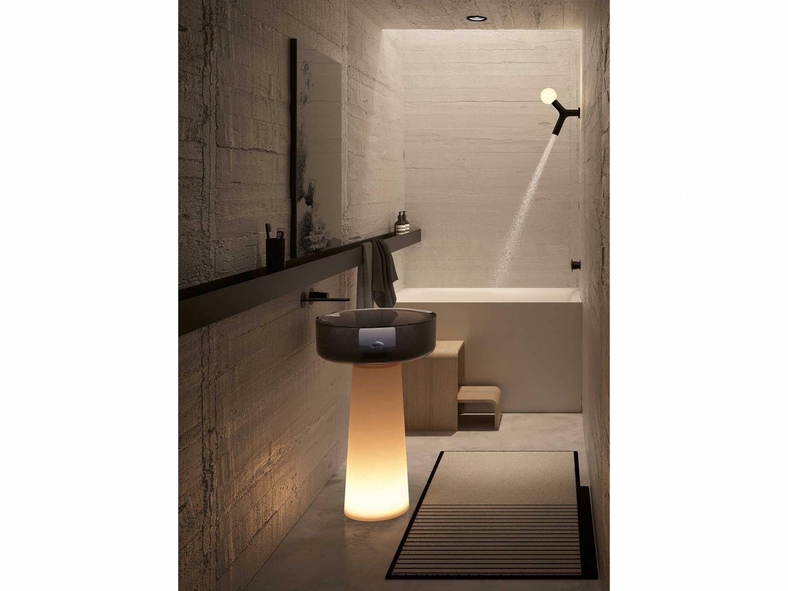 Als faszinierende Skulptur im Raum präsentiert sich das Standwaschbecken «Albume Lux» aus Flumood Dinamico. Das durchscheinende Harz sorgt für ein harmonisches Gleichgewicht zwischen Festigkeit und Leichtigkeit von Sockel und Becken, das dank der Beleuchtung von unten zu schweben scheint. Design: Carlo Colombo. ANTONIOLUPI.