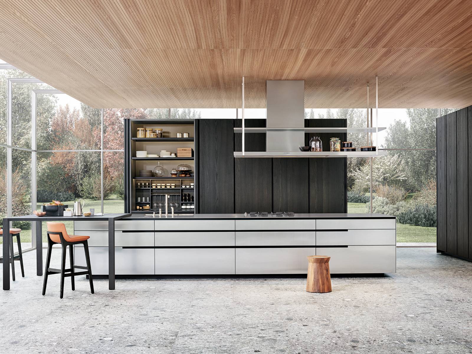 Schlichte Eleganz strahlt die exklusive Küche «Phoenix» aus, die vor allem aufgrund der besonderen und individuell gestalteten Nutöffnung besticht. In Kombination mit der Tischvariante über Eck wird die minimalistische Kücheninsel zum ästhetischen Lebensmittelpunkt. Poliform.